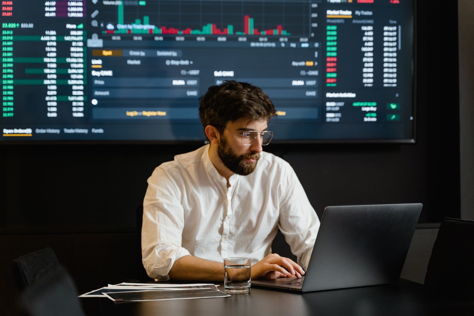 Trader reviewing financial markets at a professional workstation